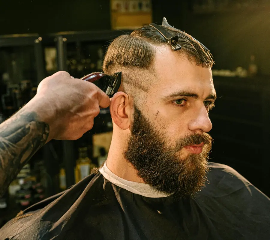 Master barber performing a mens haircut in Sioux Falls SD